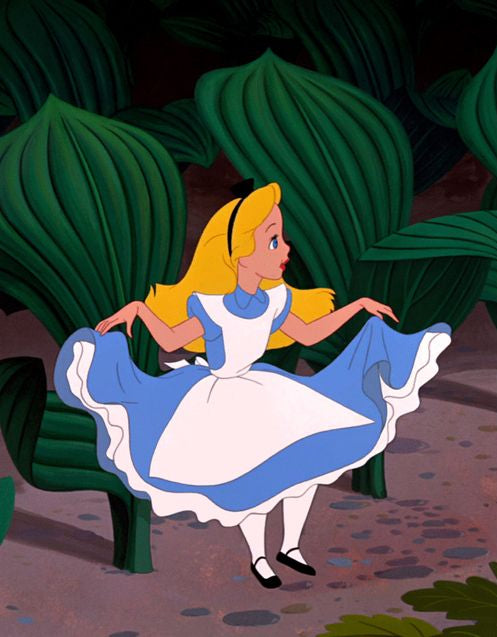 Animated character of Alice from 'Alice in Wonderland' sitting on a bench with green foliage in the background.